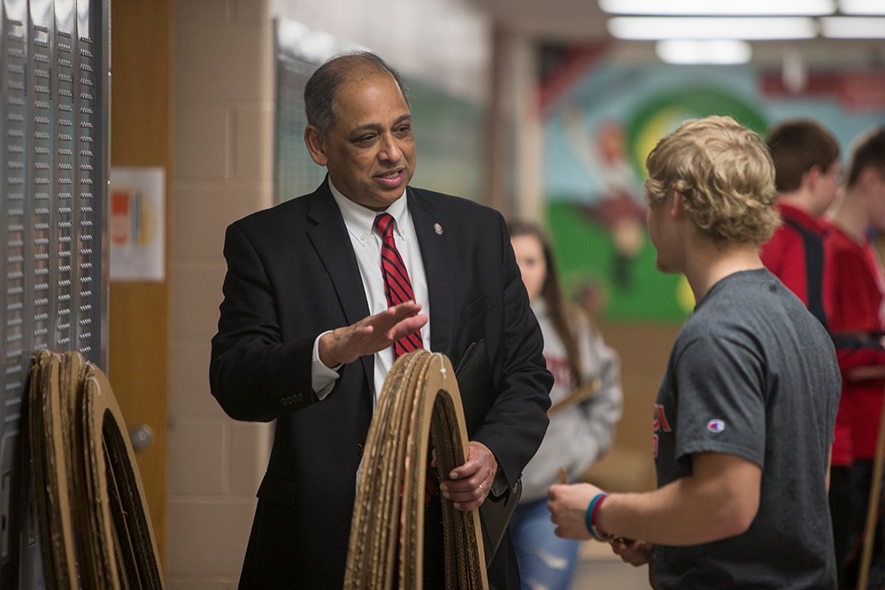 UC President Neville Pinto with high school students