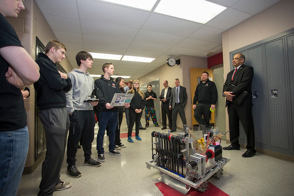 UC President Neville Pinto with high school students