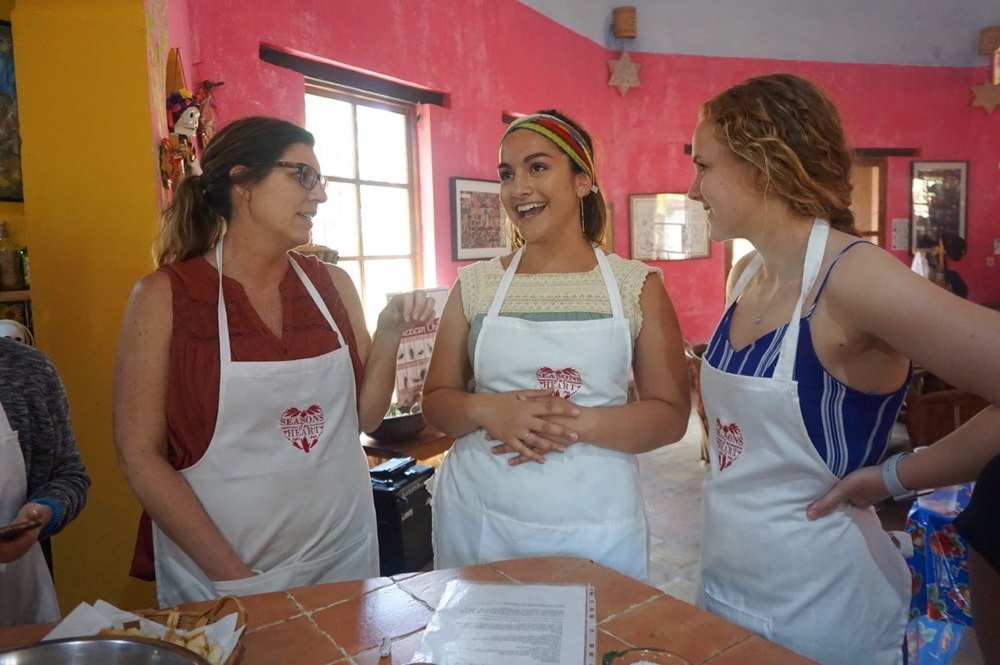 UC's Robin Selzer and her students enjoy a cooking class at the Season's of My Heart cooking school in Oaxaca, Mexico.