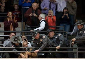 UC police remove a heckler at the Obama rally in November 2012.