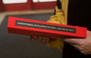 Obura was presented his custom-bound dissertation prior to the commencement ceremony.