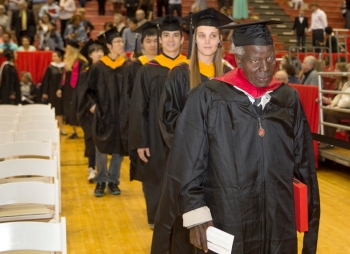 Obura lead the McMicken College of Arts & Sciences line into Fifth Third Arena.