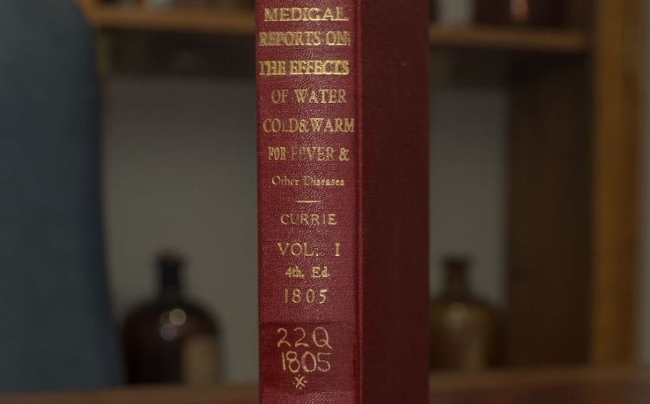 The spine of a red leather book, Medical Reports on the Effects of Water Cold & Warm for Fever & Other Diseases