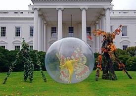 Posed on the front lawn of the white house are a vining Angel Noble, a winged Natalie Willes and a hardwood Todd Key -- all part of Philip Solomon’s Halloween entertainment for the first family.