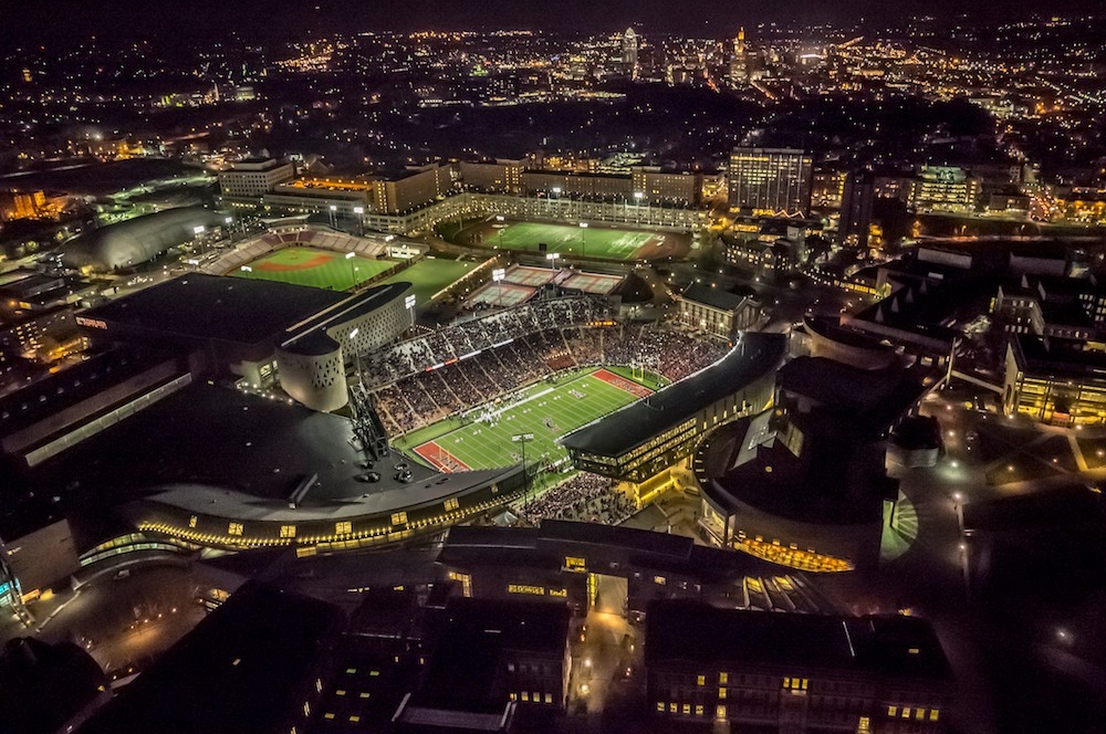 Nighttime aerial photo of UC's campus.
