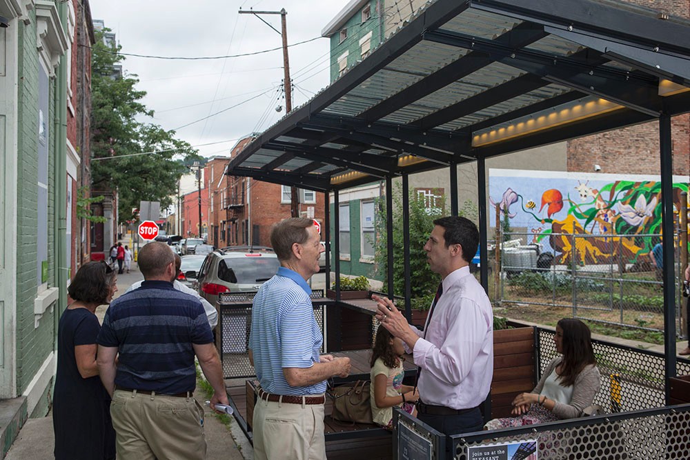 Photos/Andrew Higley/Creative Services People chat in and around the Pleasant Street parklet.