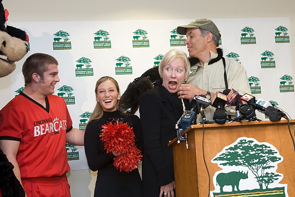 Three-month-old Lucy, the new bearcat at the Cincinnati Zoo, surprised President Zimpher in taking a shortcut from Thayne Maynard, executive director of the zoo, to UC cheerleader Haley Cook at a press conference in 2008.