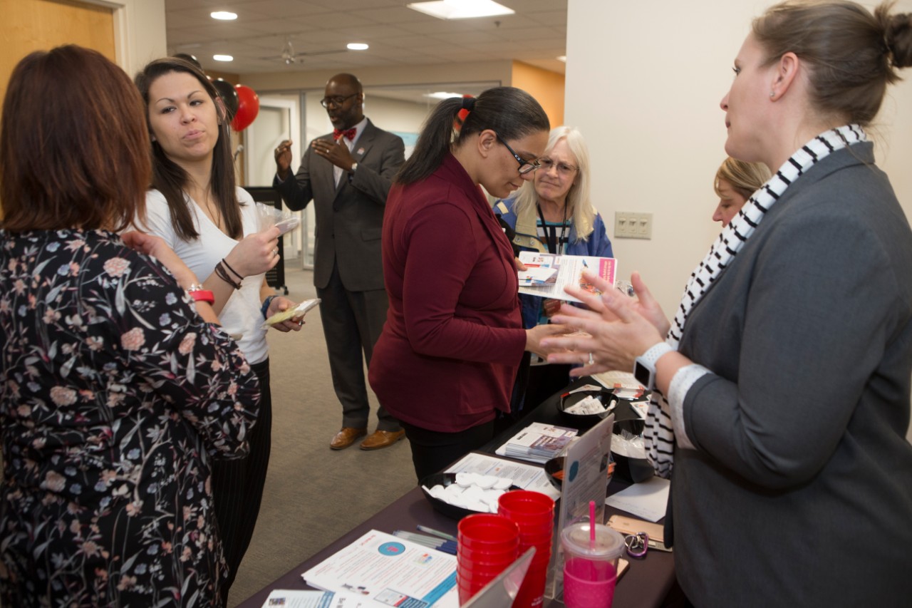 UC staff members enjoy themselves at the Staff Success Center ribbon cutting event.