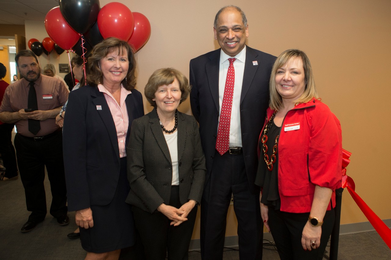 UC President Neville Pinto and other administrative members at the Staff Success Center ribbon cutting event.