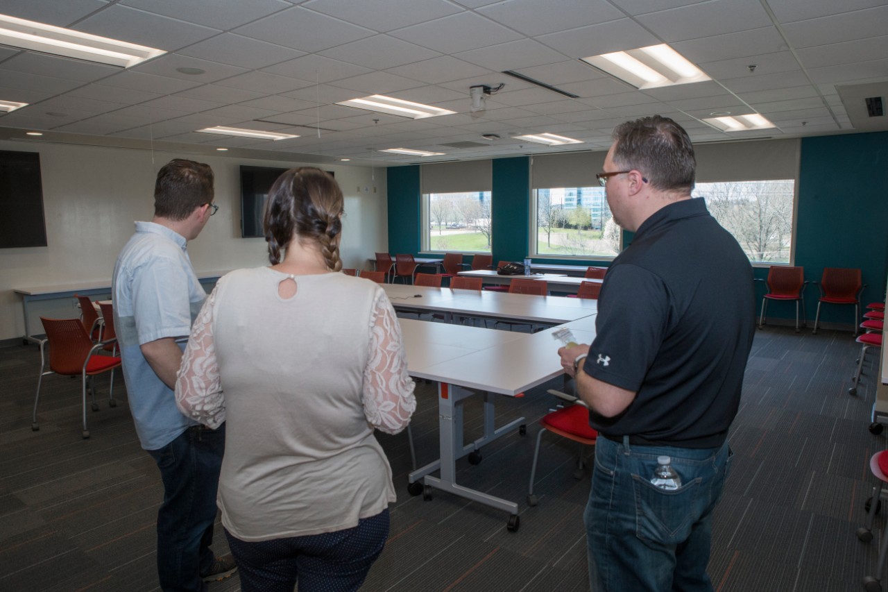 UC staff members enjoy themselves at the Staff Success Center ribbon cutting event.