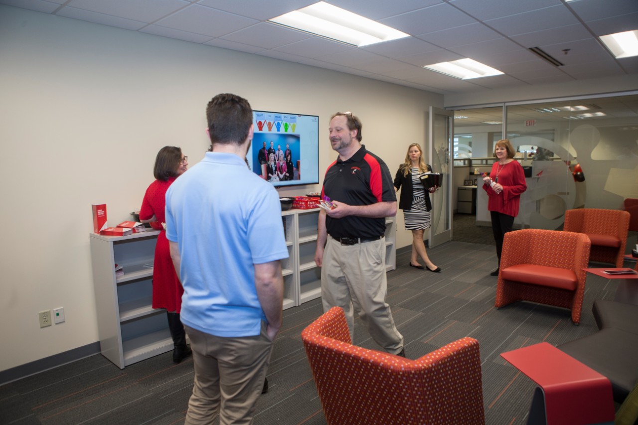 UC staff members enjoy themselves at the Staff Success Center ribbon cutting event.