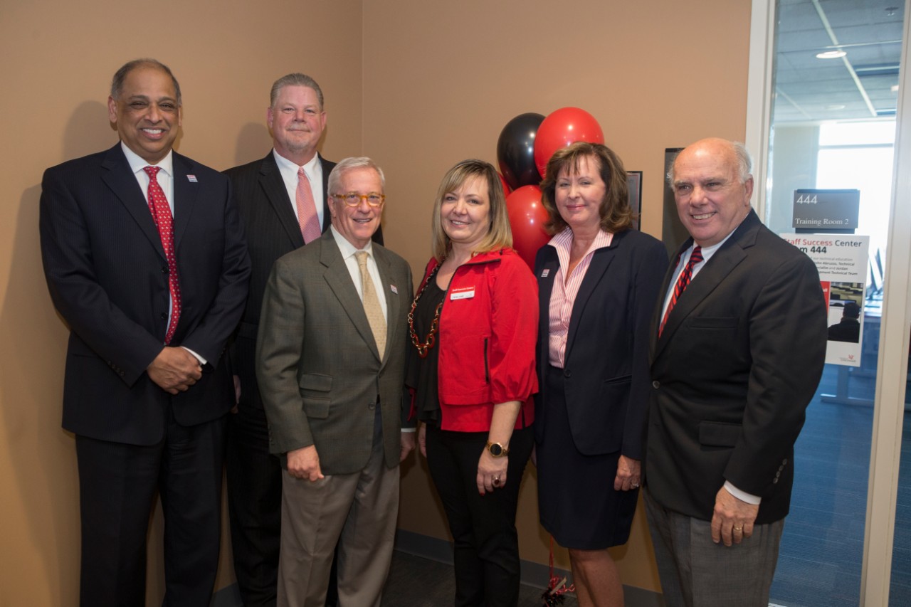 UC President Neville Pinto and other administrative members at the Staff Success Center ribbon cutting event.