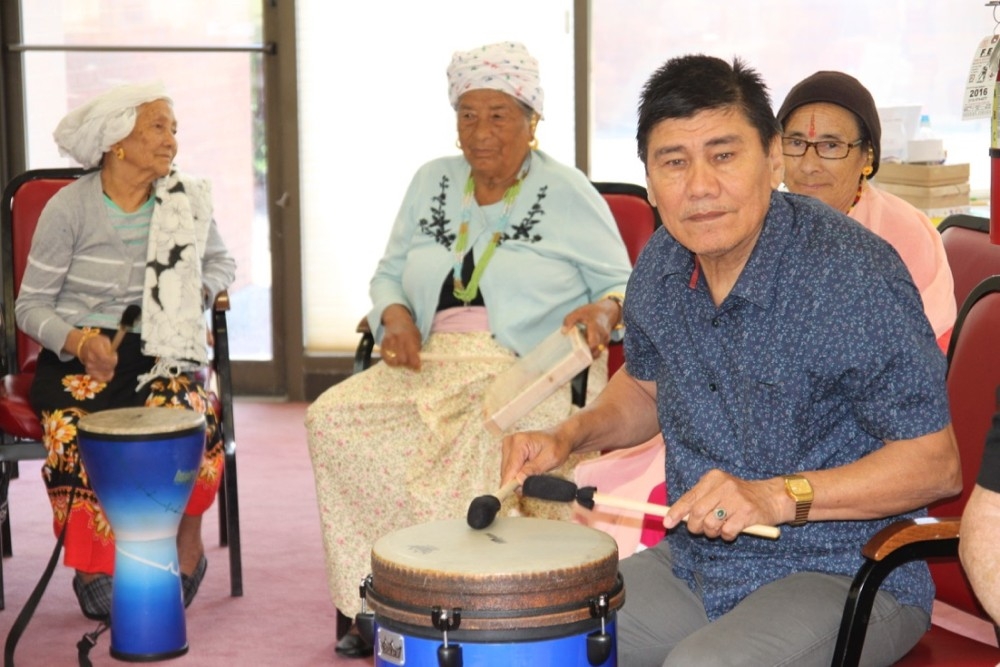 Residents of Maple Knoll Retirement Community play drums and insruments on UC Serves Day.