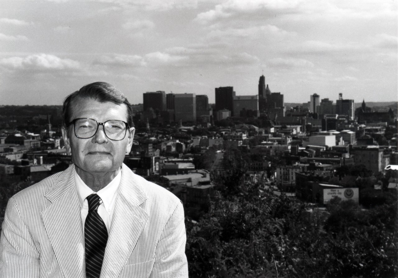 Zane L Miller sitting in front of Cincinnati skyline