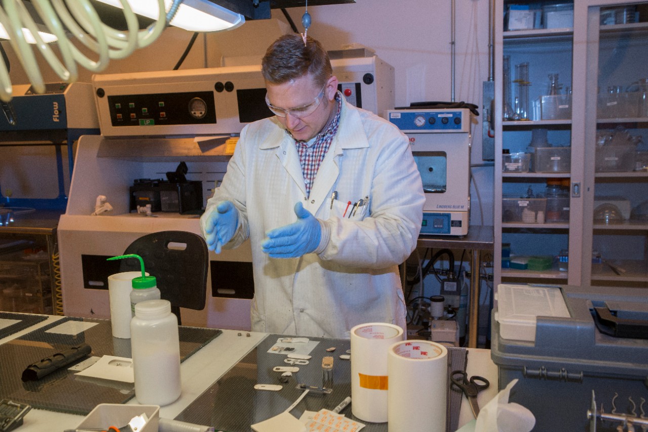 UC student Adam Hauke works on the newest generation of sweat sensors in UC's Novel Devices Lab.
