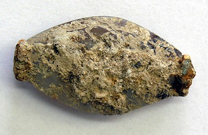 Minoan-made sealstone encrusted in limestone