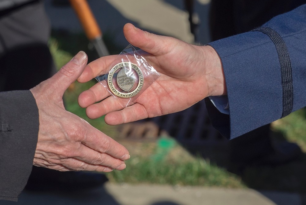 UC gave a commemorative coin to military veterans.