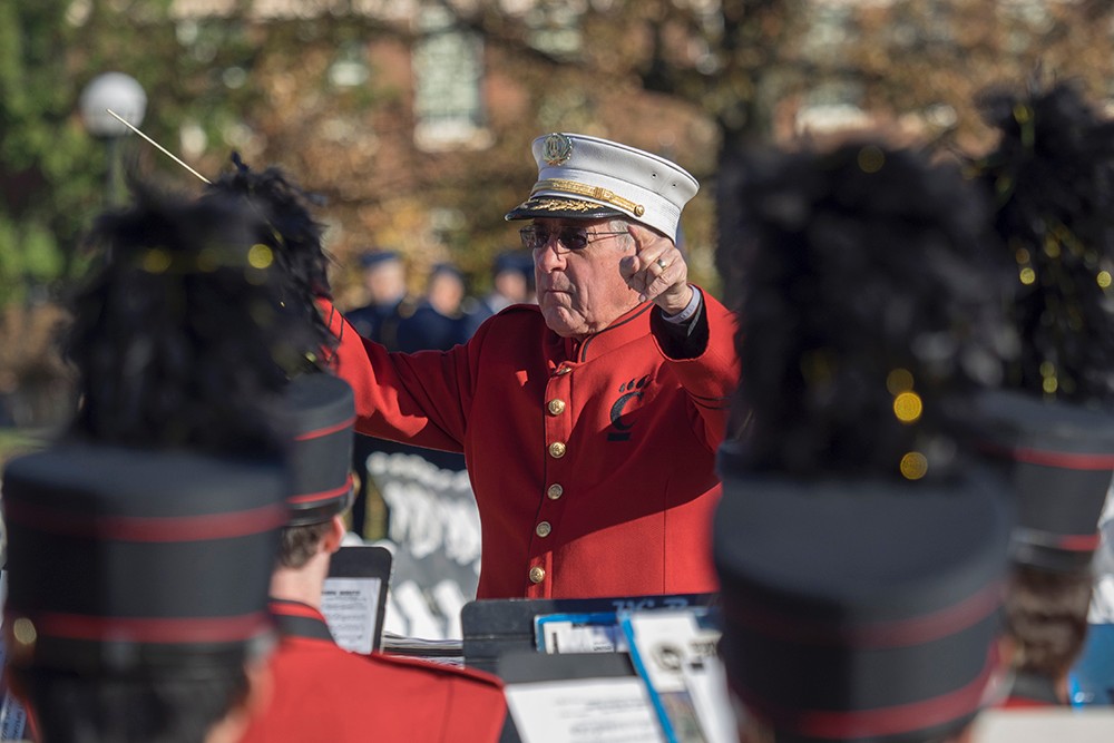 UC band director leads the band in The Star Spangled Banner