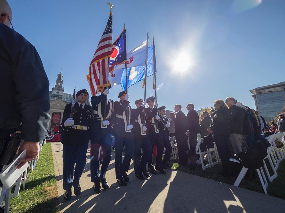 A Color Guard holding colorful flags pays tribute to the nation's veterans.