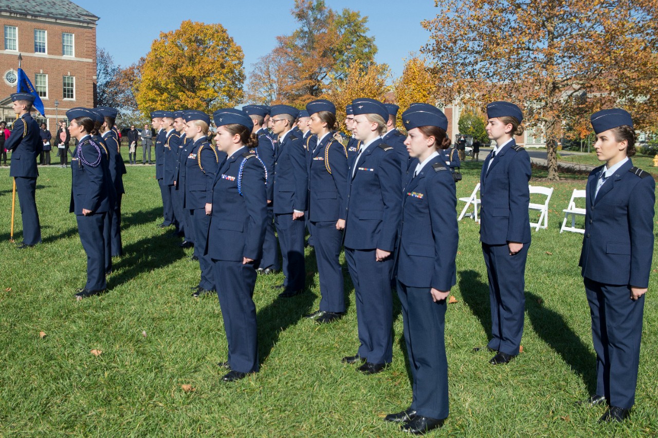 Air Force ROTC cadets stand at attention. 