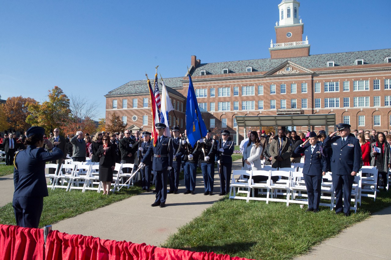 A Color Guard holding colorful flags pays tribute to the nation's veterans.