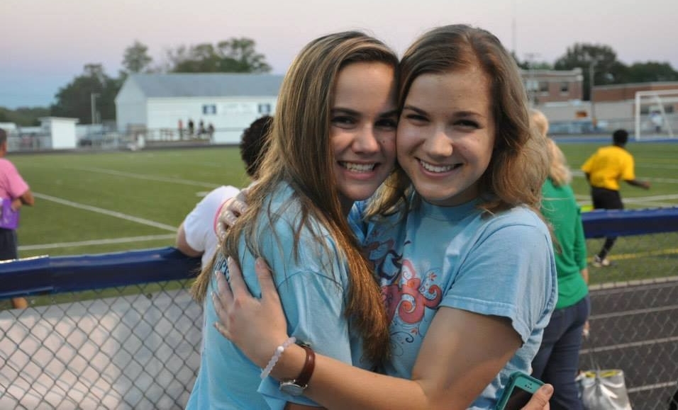 Sara Whitestone hugs her younger sister Hope 