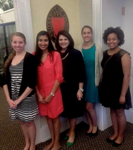 UC student Katie Dew and fellow ACM-W committee members are standing with Provost Beverly Davenport in her office after being recognized as an official group at UC.