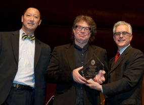 Edelman receives the Kautz Master's Series award from CCM Dean Peter Landgren (right) and President Santa Ono