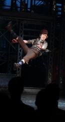 Ryan Breslin leaps at the opening-night curtain call of "Newsies." 