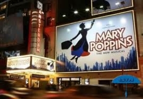 The primary Mary Poppins sign at the theater lit up.