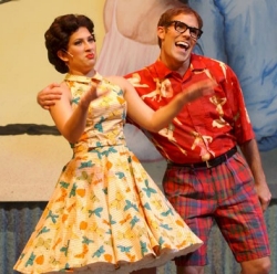 Brandon Bieber in plaid shorts and a girl in an 1960s dress,