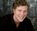 Head shot of Preston Boyd and his curly blond hair