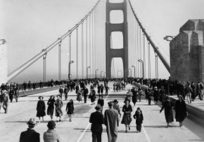 People walking across the Golden Gate Bridge in 1937.