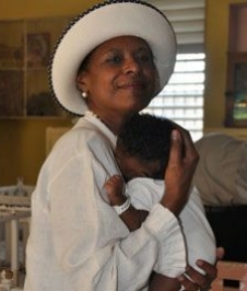 Pamela Bridgewater cuddles Jamaican infant