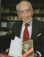 Werner Von Rosenstiel holding books from WWII.