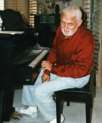 Al Hague at his living room piano.