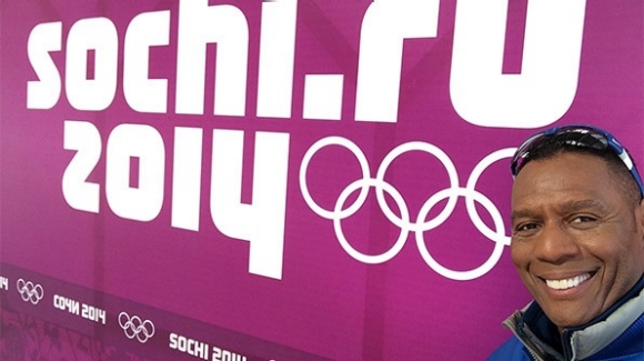 Lewis Johnson poses in front of an Olympic sign at Sochi.