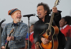 Pete Seeger and Bruce Springsteen play instruments together