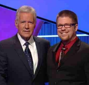 UC grad John Anneken poses with Jeopardy host Alex Trebek