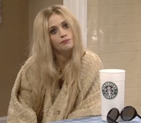 Zooey Deschanel is in a skit with long blonde hair.