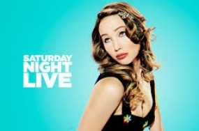 Jennifer Lawrence poses for a SNL promo shot with loads of curly hair.