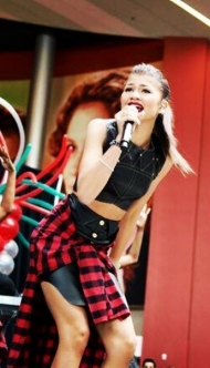 Zendaya sings on stage at an outdoor concert