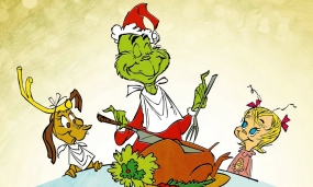 A happy ending to the movie as the Grinch carves the roast beast.