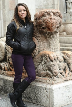 Molly O'Connolly pictured next to a sphynx type statue.