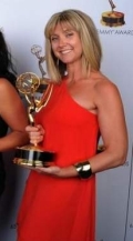 Cara Hannah Sullivan holding her 2013 Emmy