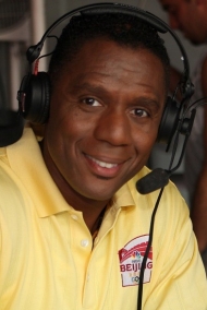 Lewis Johnson wearing headphones while broadcasting.