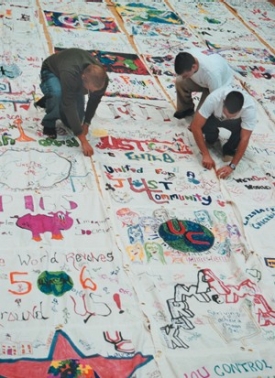 Students working on flag