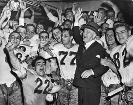 Walter Langsam celebrates with UC football team.