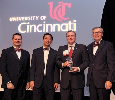 A photo of four important figures at the University of Cincinnati, Rodney Grabowski, Santa Ono, Phil Collins and Robert Fealy.