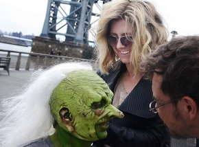 University of Cincinnati alum Cara Sullivan is shown working on the crazy white hair of an actor in costume for the television show "Saturday Night Live."